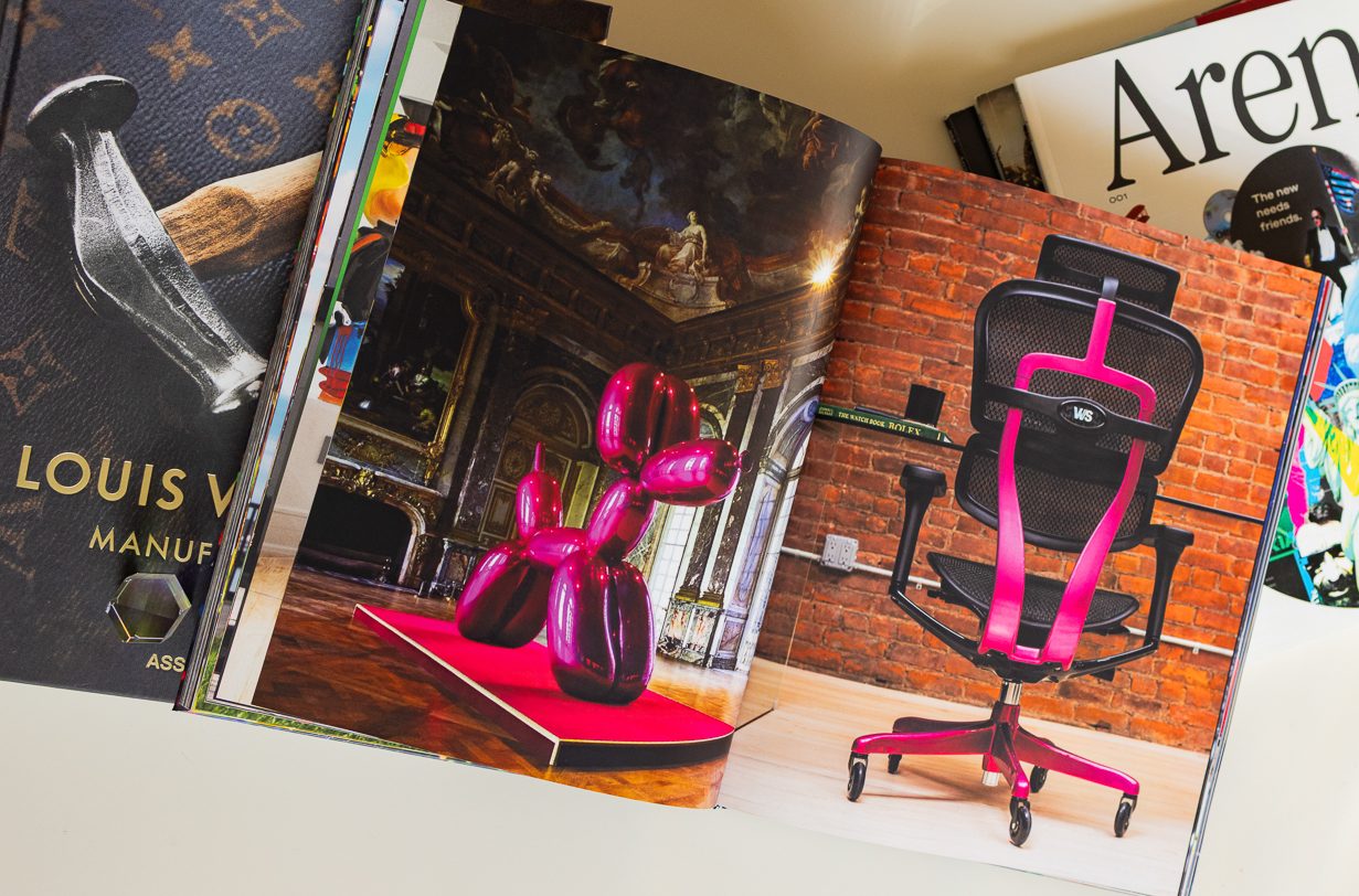 Interior spread — pink chair with art